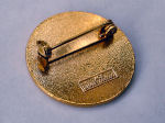 Badge with brooch pin fitting